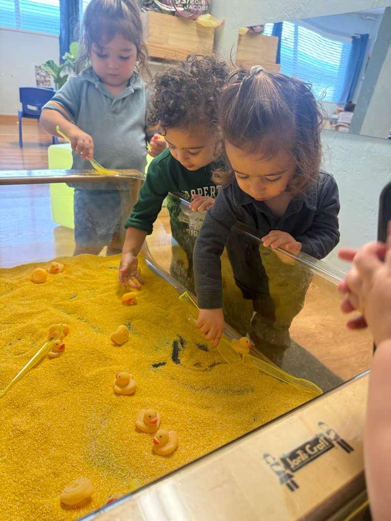 Children exploring a sensory table